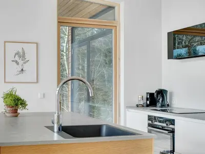 a kitchen with a sink and a window at Holiday Home Haubert - 500m to the fjord by Interhome in Lihme