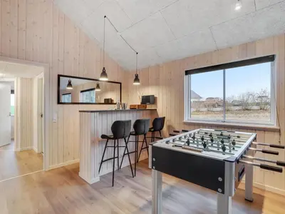 a game room with a chess board on a table at Holiday Home Sibbe - 500m to the fjord by Interhome in Spottrup