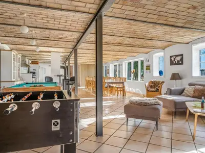 a living room with a pool table at Holiday Home Kara - 100m to the fjord by Interhome in Fur