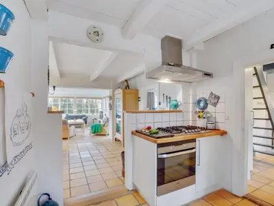 a kitchen with white walls and a stove top oven at Holiday Home Althea - 750m to the fjord by Interhome in Fur