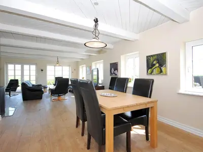a dining room with a table and chairs at Holiday Home Alois - 1km to the fjord by Interhome in Hesselbjerg