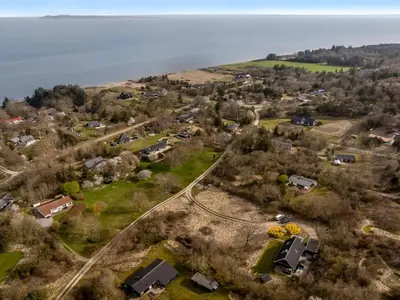 an aerial view of a small village next to the water at Holiday Home Thyra - 500m to the fjord by Interhome in Fur
