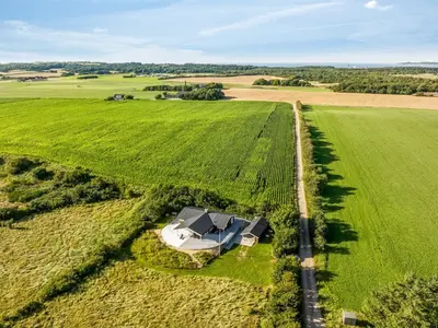 an aerial view of a farm house in a field at Holiday Home Eljas - 200m to the fjord by Interhome in Fur