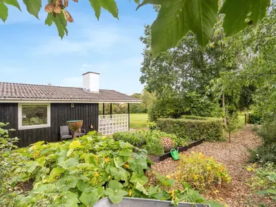 a garden in front of a house at Holiday Home Suoma - 400m to the fjord by Interhome in Roslev