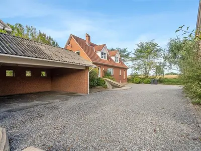 a brick house with a driveway in front of it at Holiday Home Auguste - 1-5km to the fjord by Interhome in Fur