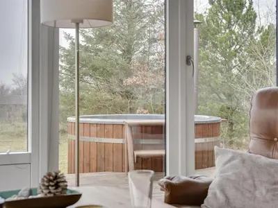 a living room with a tub in a window at Holiday Home Lefke - 400m to the fjord by Interhome in Roslev