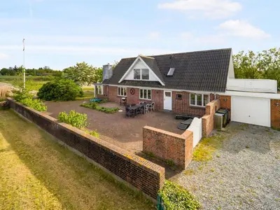 an aerial view of a house with a brick wall at Holiday Home Emmie - 50m to the fjord by Interhome in Skarum