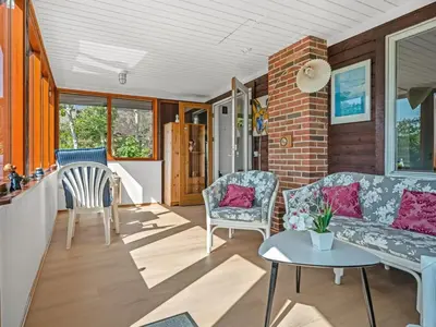 a living room with a couch and chairs at Holiday Home Imgert - 300m to the fjord by Interhome in Løgstrup