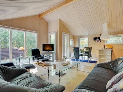 a living room with a couch and a tv at Holiday Home Jussi - 3-5km from the sea by Interhome in Brovst