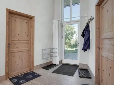 a room with a door and a window and mats at Holiday Home Ullvi - 3-8km from the sea by Interhome in Brovst