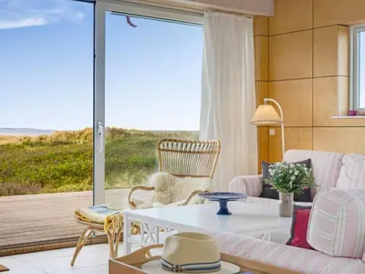 a living room with a view of the ocean at Holiday Home Tinea - 50m from the sea by Interhome in Pandrup