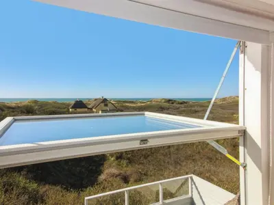 a swimming pool in the window of a house at Holiday Home Emiline - 250m from the sea by Interhome in Saltum