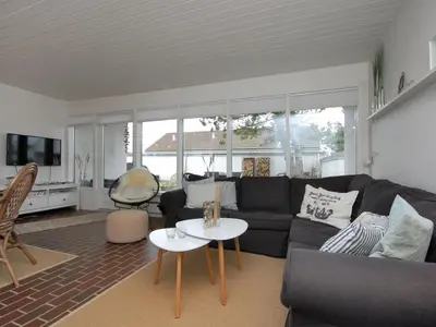 a living room with a couch and a table at Holiday Home Frieda - 7-2km from the sea by Interhome in Pandrup