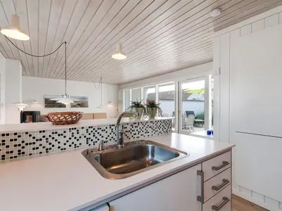 a kitchen with a sink and a counter top at Holiday Home Ara - 700m from the sea by Interhome in Pandrup