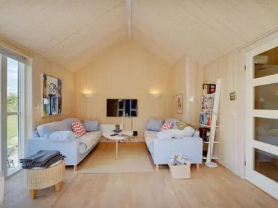a living room with two couches and a tv at Holiday Home Eireen - 600m to the fjord by Interhome in Farsø