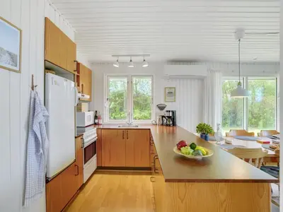 a kitchen with a bowl of fruit on a counter at Holiday Home Thina - 750m to the fjord by Interhome in Løgsted