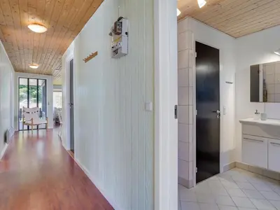 a hallway of a home with white walls and wooden ceilings at Holiday Home Ludde - 500m to the fjord by Interhome in Løgstør