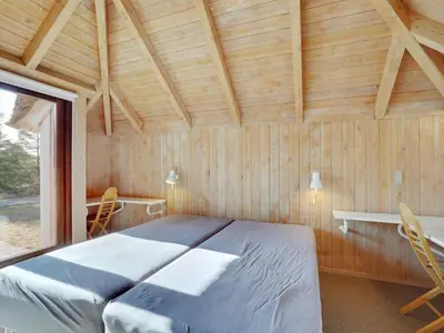 a bedroom with a bed in a room with a window at Holiday Home Waldar - 900m from the sea by Interhome in Fjerritslev