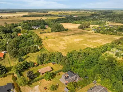 an aerial view of a field and farm at Holiday Home Thurir - 4km from the sea by Interhome in Fjerritslev