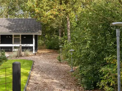 a house with a gravel driveway in front of it at Holiday Home Grimi - 4km from the sea by Interhome in Fjerritslev