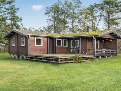 a small wooden house with a large yard at Holiday Home Artur - 1-5km from the sea by Interhome in Fjerritslev