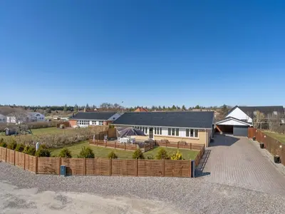 an aerial view of a house with a fence at Holiday Home Bitta - 500m from the sea by Interhome in Fjerritslev