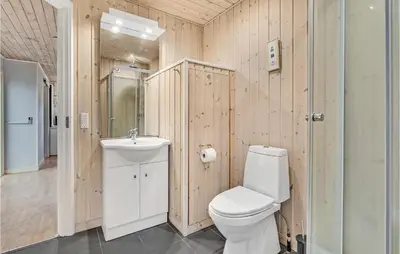 a bathroom with a toilet and a sink at Beautiful Home In Hanstholm With Wifi in Hanstholm