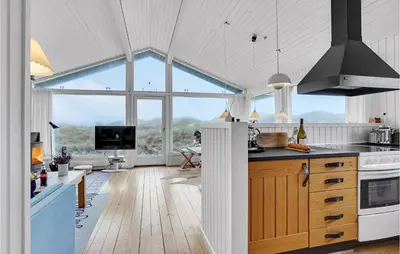 a kitchen with a counter and a large window at Beautiful Home In Pandrup With Wifi in Pandrup