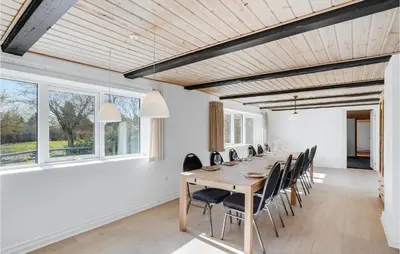 a large dining room with a long table and chairs at Gorgeous Home In Højslev With Wifi in Højslev