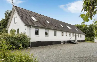 a white building with a black roof at Gorgeous Home In Højslev With Wifi in Højslev