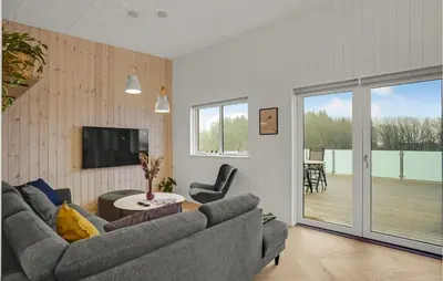 a living room with a couch and a table at Beautiful Home In Spøttrup With Wifi in Spottrup