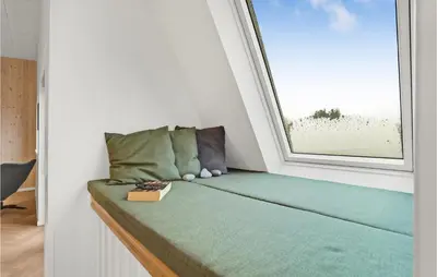a bed in a room with a window at Beautiful Home In Spøttrup With Wifi in Spottrup