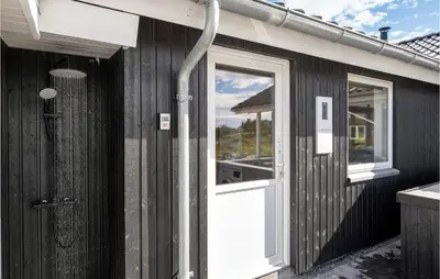 a house with a door and a window at Cozy Home In Vestervig With Wifi in Vestervig