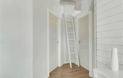a room with white walls and a ladder in it at Cozy Home In Vestervig With Wifi in Vestervig