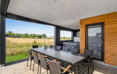 an outdoor dining room with a table and chairs at Pet Friendly Home In Løgstrup With Wifi in Løgstrup