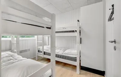 two white bunk beds in a white room at Pet Friendly Home In Løgstrup With Wifi in Løgstrup