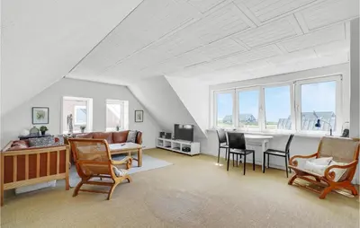 a living room with a couch and a table and chairs at Gorgeous Home In Vestervig With Wifi in Vestervig