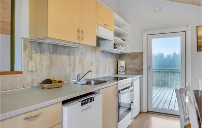 a kitchen with a sink and a counter top at 2 Bedroom Nice Home In Hanstholm in Hanstholm