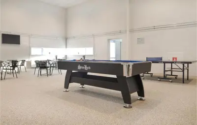 a ping pong table in a room with a pool table at Gorgeous Apartment In Brovst With Wifi in Brovst