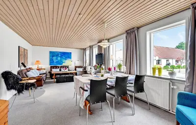 a living room with a table and chairs at 2 Bedroom Gorgeous Home In Roslev in Roslev
