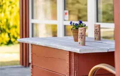 a table with two plants on top of it at 4 Bedroom Pet Friendly Home In Løgstør in Løgstør