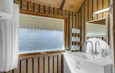 a bathroom with a sink and a window at 4 Bedroom Pet Friendly Home In Løgstør in Løgstør