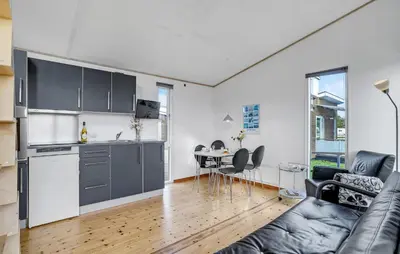 a kitchen and a living room with a couch at 1 Bedroom Nice Home In Vestervig in Vestervig