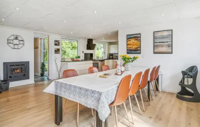 a kitchen and dining room with a table and chairs at Lovely Home In Thisted With Sauna in Thisted