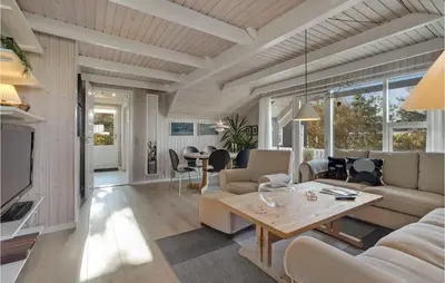 a living room with a couch and a table at Lovely Home In Vestervig With Wifi in Vestervig