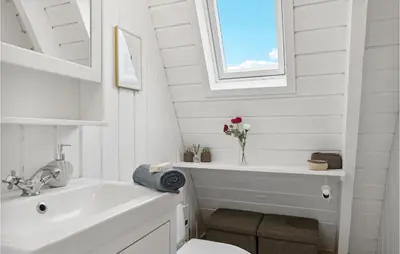 a white bathroom with a sink and a bath tub at Amazing Home In Farsø With Wifi in Farsø