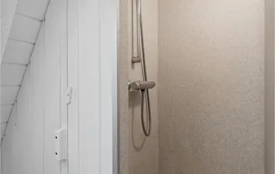 a shower door with a shower head in a bathroom at Amazing Home In Farsø With Wifi in Farsø