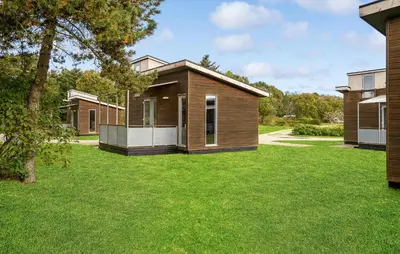 a home with a green yard with houses at Cozy Home In Vestervig With Kitchen in Vestervig