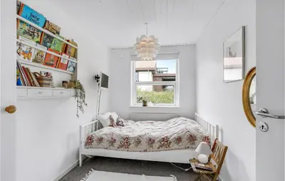 a white bedroom with a bed and a window at Gorgeous Home In Thisted in Torsted