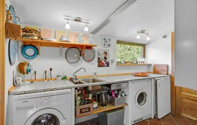a kitchen with a sink and a washing machine at 2 Bedroom Stunning Home In Bedsted Thy in Bedsted Thy